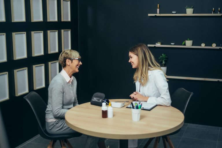 Doctor in consultation with a senior woman patient