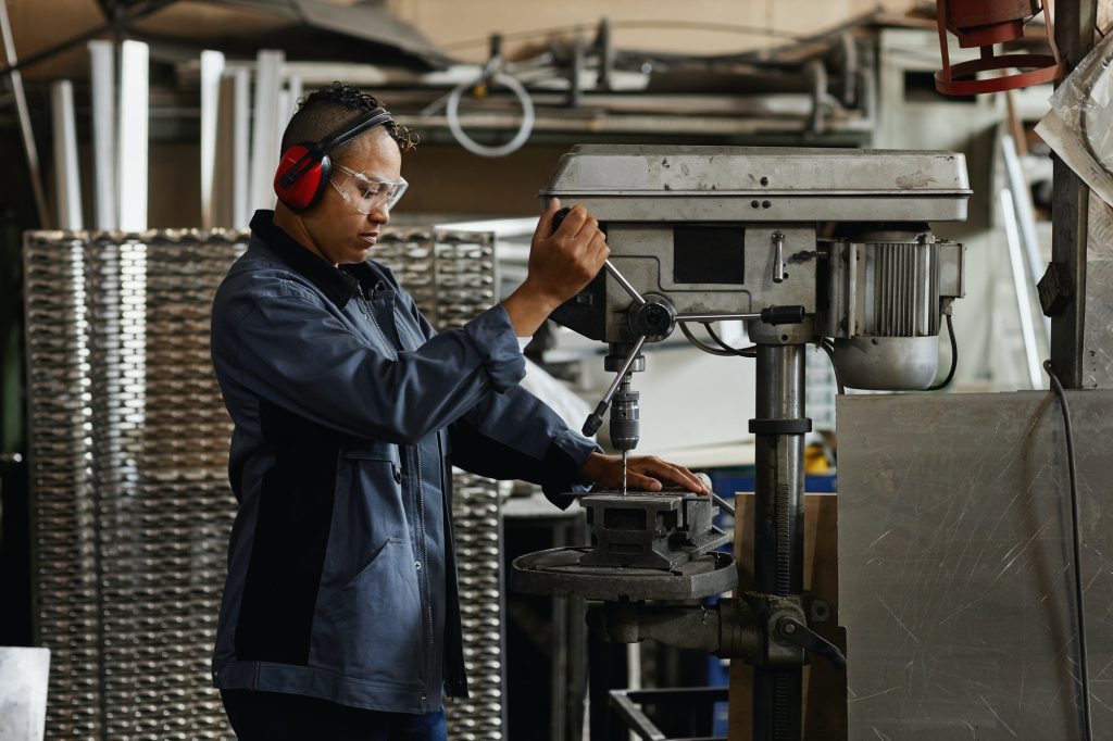 Woman Working At Industrial Factory